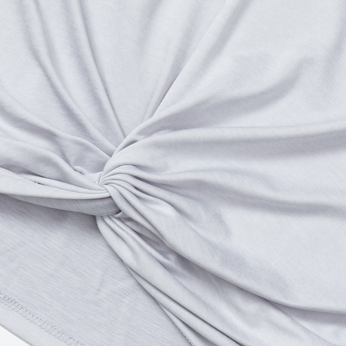 White long-sleeve top with twisted front knot detail at center chest.