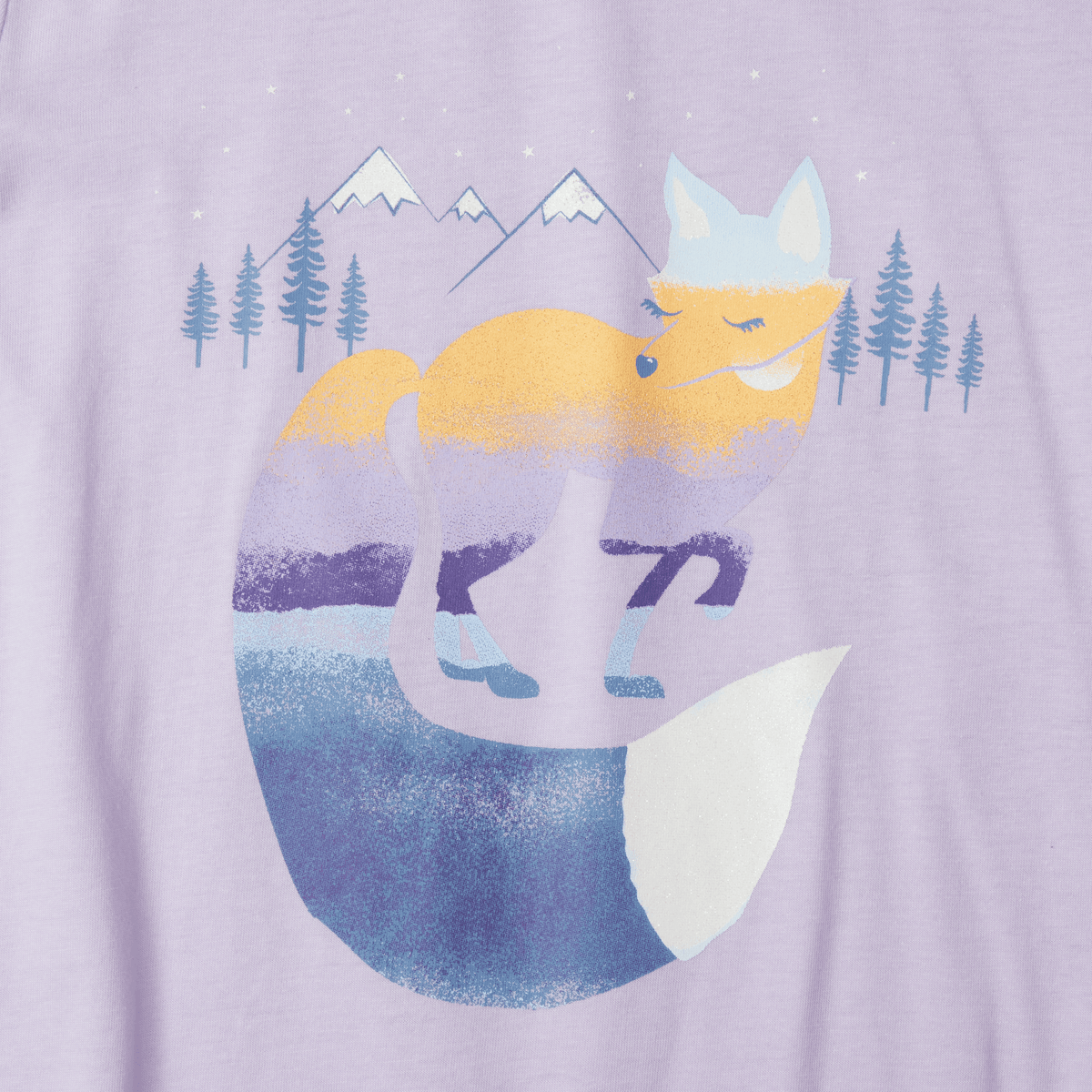 Lavender long sleeve tee featuring a layered graphic of a yellow fox with white ears, mountains, and evergreen trees.