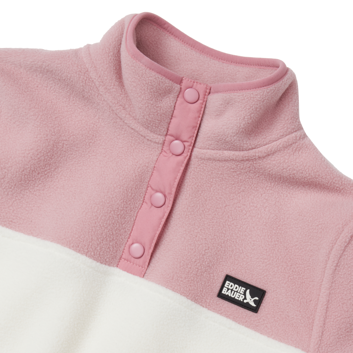 Pink and white fleece pullover with snap neck closure and brand label visible on chest.