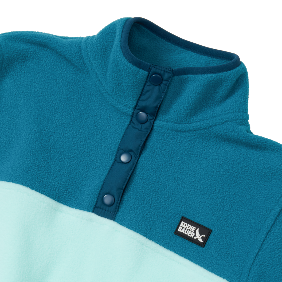 Teal and light blue fleece pullover with snap neck closure and brand label visible on chest.