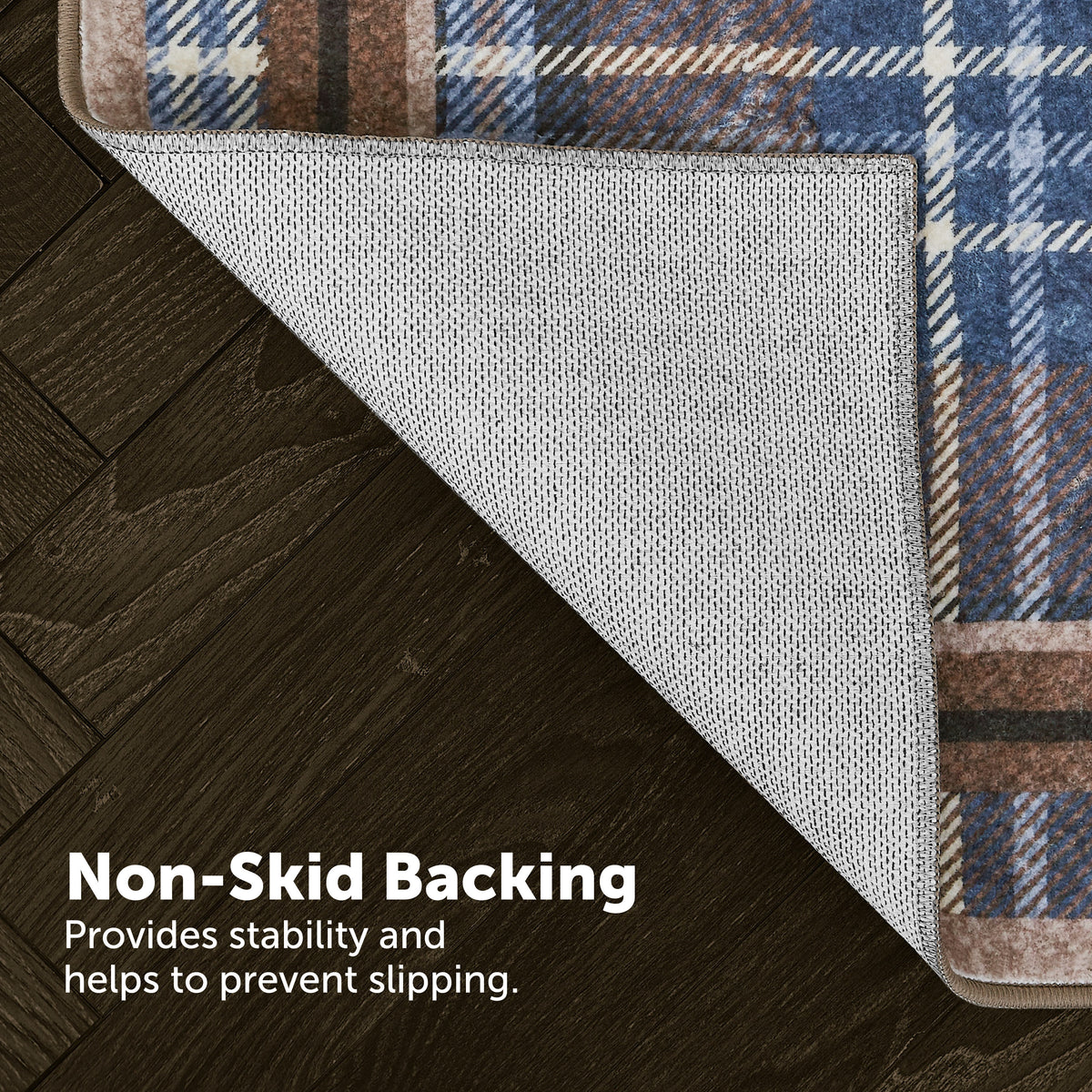 Rug with plaid border on wooden floor, highlighting non-skid backing.