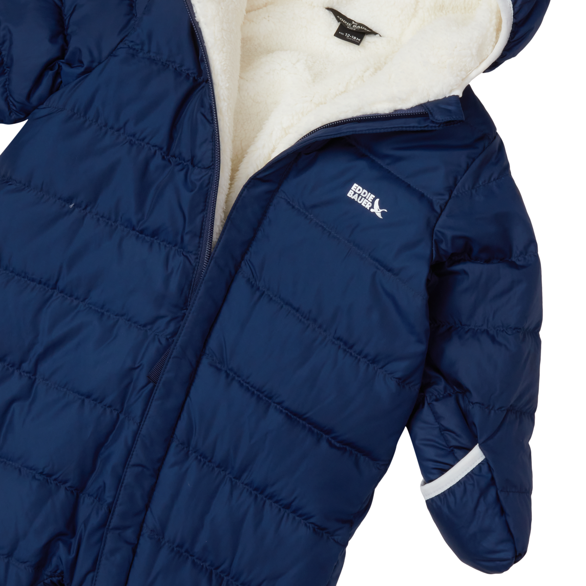 Navy quilted down snowsuit with cream fleece lining and white reflective stripe on sleeve.